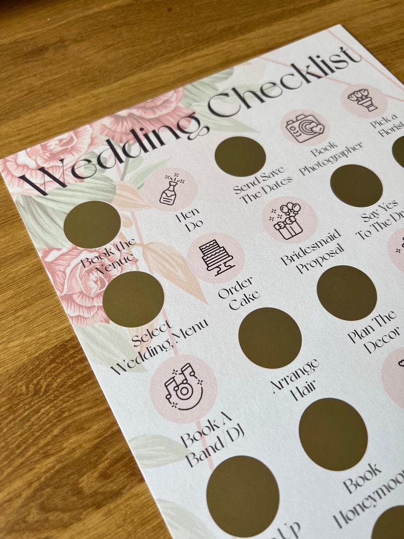May include: A wedding checklist with gold circles and icons representing tasks to be completed. The checklist includes tasks such as booking the venue, sending save the dates, ordering the cake, and planning the decor.