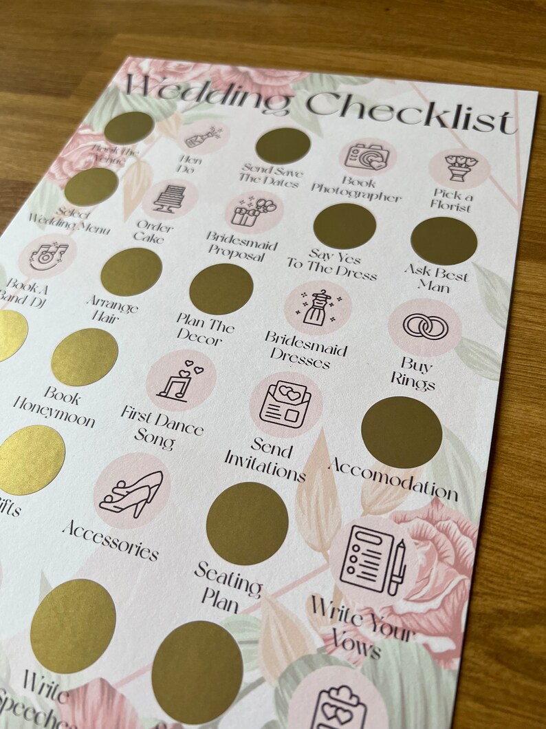 May include: A wedding checklist with gold circles and pink floral accents. Each circle has a different task to complete, such as book a band, order the cake, and send invitations.