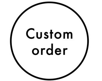 May include: A white circle with a black outline and the text "Custom order" in black.