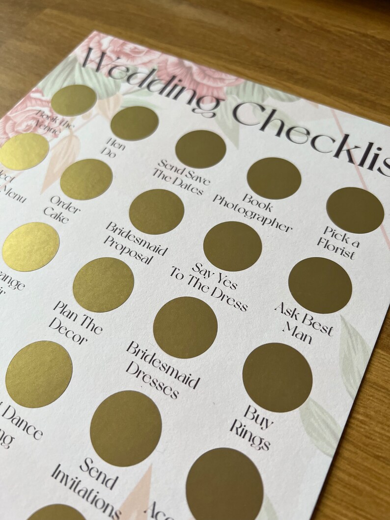 May include: A wedding checklist with gold circles and white text. The checklist includes tasks such as booking the venue, sending save the dates, ordering the cake, and buying rings.