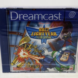 Op de afbeelding: Dreamcast-gamecase voor "Buzz Lightyear of Star Command". De case heeft een blauw en wit logo met Buzz Lightyear in een ruimtescène. De game is een Disney Pixar-titel.