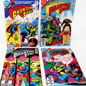 May include: Four comic books featuring Superman and the Phantom Zone. The covers are red, blue, and yellow with illustrations of Superman, Supergirl, and other characters. The text on the covers reads "Phantom Zone".