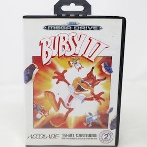 May include: A Sega Mega Drive video game cartridge for Bubsy II. The game case features a cartoon cat character in a white shirt and red shorts, with the game title in large red letters. The Accolade logo is at the bottom.