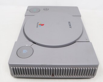 Sony PlayStation 1 PS1 SCPH-5552 + 9 Jeux + Câble Link SCPH-1040