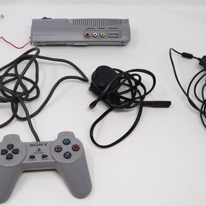 Vintage Sony Playstation 1 PS1 Pal Console SCPH-7502 Fully Working, Gamars Movie Card VCD Not Working Controllers 2 Games Lot Bundle image 6