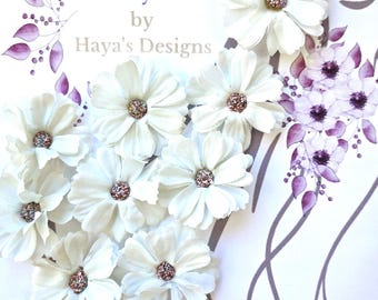 May include: White fabric flower veil weights with glitter centers. The image includes the text "Veil Weights" and "Created just for you by Haya's Designs". The flowers are arranged in a heart shape.