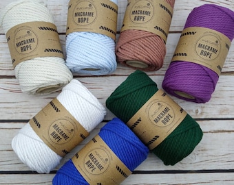 May include: Assortment of 100% recycled cotton macrame rope in various colors, including white, light blue, brown, purple, green, and blue. Each spool has a label that reads "maccaront Macrame Rope".