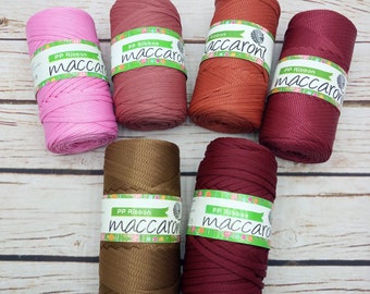 May include: Six spools of PP ribbon in various colors, including pink, red, brown, and burgundy. Each spool has a green label with the text "PP Ribbon maccaron" printed on it.
