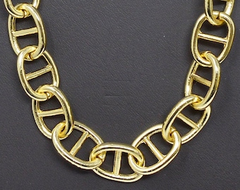 May include: A gold chain necklace with a mariner link design. The chain is made of metal and has a shiny finish.
