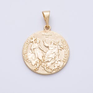 May include: Gold-colored pendant with a detailed religious design. The round pendant features figures, text, and a dove. The pendant has a loop at the top for a chain.