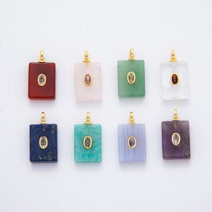 May include: Eight rectangular gemstone pendants in various colors, including red, pink, green, white, blue, teal, purple, and blue-grey. Each pendant has a gold-colored bail and a small, oval-shaped gemstone in the center.
