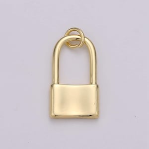 May include: A gold-toned padlock charm with a smooth, shiny finish. The padlock has a rounded top and a rectangular body.