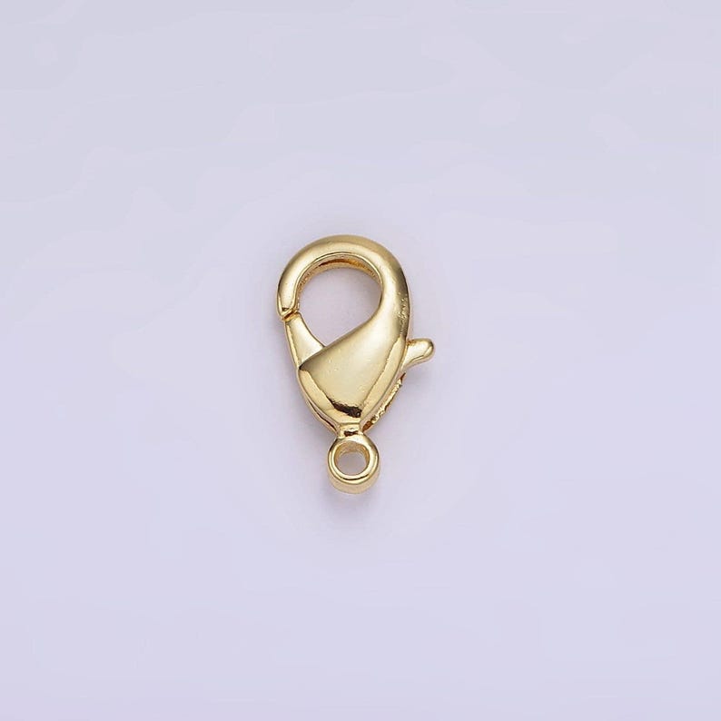 May include: Gold-toned metal lobster clasp for jewellery making. The clasp is a popular choice for necklaces, bracelets, and other jewellery projects.