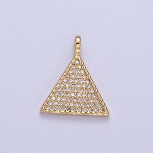 May include: Gold triangle pendant with clear cubic zirconia stones.