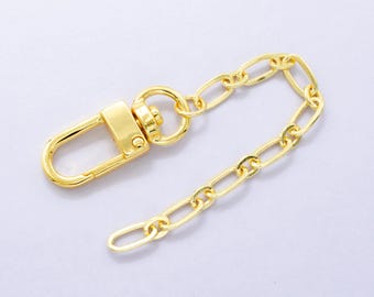 Pode incluir: Uma corrente de metal dourado com um fecho de lagosta. A corrente tem aproximadamente 25 cm de comprimento.
