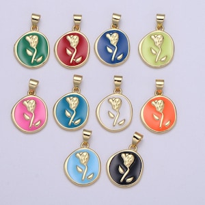 May include: Assortment of ten gold-tone pendants with a rose design. Each pendant features a different colored enamel background: green, red, blue, light green, pink, teal, white, orange, light blue, and black.