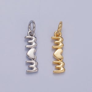 May include: Two silver and gold charm pendants with the word "love" spelled out in a stylized font with a heart in the middle.