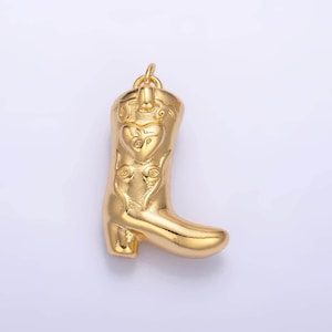 May include: Gold-toned metal charm shaped like a cowboy boot with a heart design on the top.