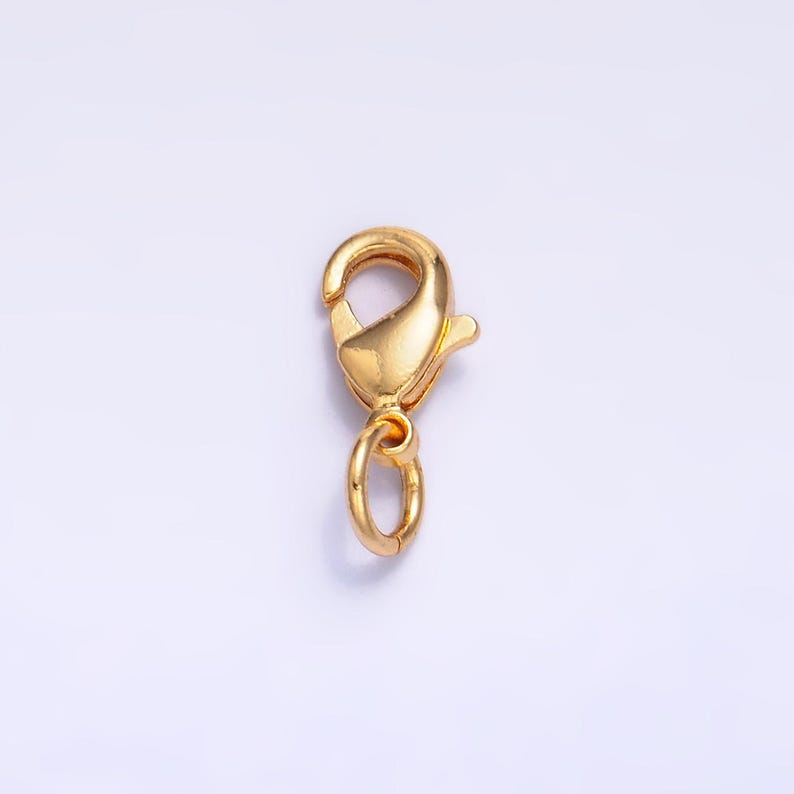 May include: Gold-toned metal lobster clasp with a jump ring. This clasp is used for jewelry making and is a popular choice for necklaces, bracelets, and other jewelry.