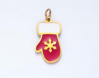 May include: A gold-coloured charm in the shape of a red mitten with a white cuff and a gold snowflake design.