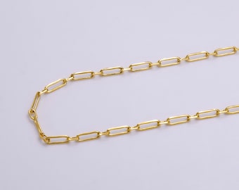 May include: A gold chain necklace with a simple, linked design. The chain is made of small, rectangular links.