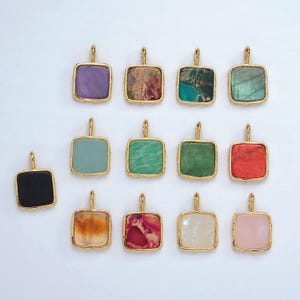 May include: Assortment of 14 gold square pendants with different coloured stone inlays. The stones are in various shades of green, red, purple, brown, black, and white.