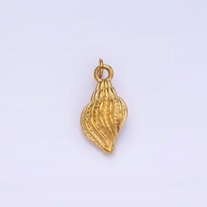 May include: A gold-colored seashell pendant charm. The seashell is detailed with a textured, swirling design.