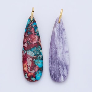 May include: Two teardrop-shaped earrings. One earring features a mix of red, turquoise, and brown colors. The other earring is a solid lavender color with white marbling. Both earrings have gold-colored hooks.