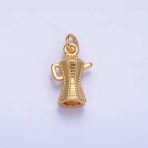 May include: A gold-colored metal charm in the shape of a traditional coffee pot. The charm has a detailed design and is perfect for adding a touch of elegance to jewelry.