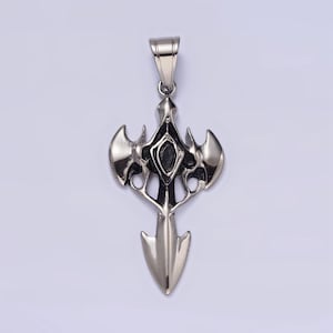 May include: A silver pendant in the shape of a stylized cross with a black center. The pendant has a sharp point at the bottom and two wings on either side.