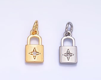 May include: Two lock charms, one gold and one silver, with a small diamond-shaped stone in the center of each lock.