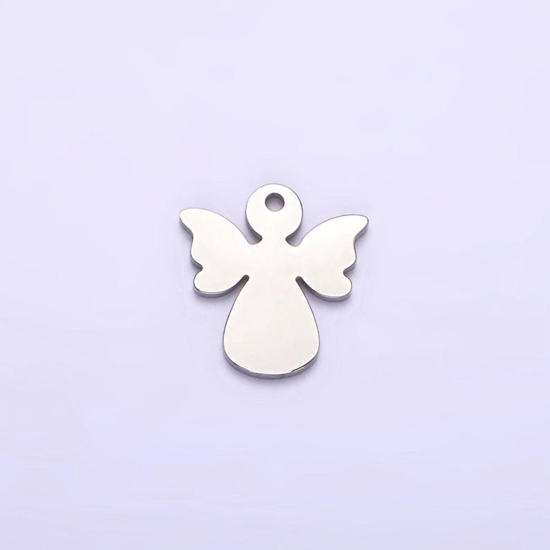 May include: Silver angel charm with a hole at the top for attaching to a necklace or bracelet.