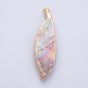 May include: A gold-toned pendant with an iridescent, pearlescent inlay. The pendant has a leaf-like shape with a curved design. The inlay features a mix of colors, including pink, green, and yellow. A small loop is at the top for hanging.