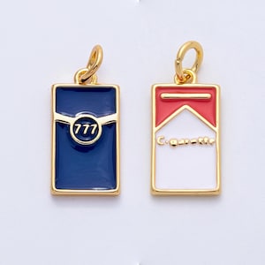 May include: Two gold-toned rectangular charms. One is navy blue with a gold border and the number "777" in a circle. The other charm is white with a red top and the word "Cigarette" in gold.