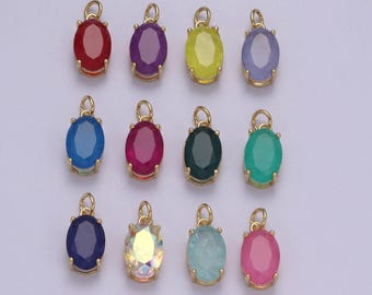 Puede incluir: Doce colgantes ovalados de oro con piedras de vidrio de diferentes colores. Las piedras son roja, púrpura, amarilla, azul claro, azul oscuro, rosa, verde, rojo rubí, verde oscuro, iridiscente, azul claro y rosa claro.