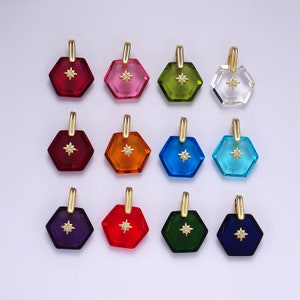 May include: Twelve hexagonal glass pendants with a gold star charm in the center. The pendants are in various colors, including red, pink, green, clear, orange, blue, turquoise, purple, and dark blue.