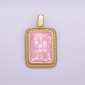 May include: A gold pendant with a pink rectangular mosaic tile.