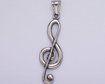 May include: A silver treble clef pendant charm. The charm is a detailed representation of a musical note.