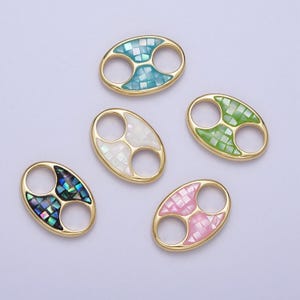 May include: Five gold oval-shaped connector charms with a double loop. Each charm has a different colored inlay of iridescent mosaic tiles. The colors are turquoise, white, green, pink, and black.