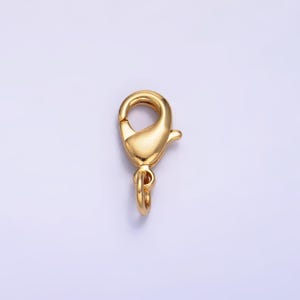 May include: Gold-toned metal lobster clasp with a spring-loaded closure. This clasp is commonly used for jewelry making and crafting.