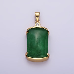 May include: A gold pendant with a green jade stone and a small clear diamond accent.