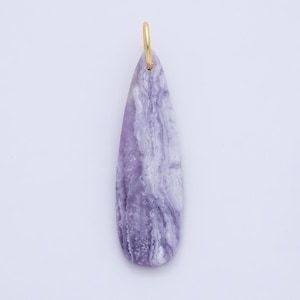 May include: A teardrop-shaped pendant with a marbled purple and white pattern. The pendant has a gold-colored loop at the top for hanging. The stone-like pendant is a unique accessory.