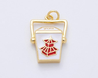 May include: Gold-toned charm in the shape of a Chinese takeout container. The charm features a white enamel front with a red pagoda design and the word "you" on the top. The charm has a gold handle and a loop for attaching to a chain.