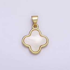 May include: A gold-tone pendant featuring a four-leaf clover design with a white mother-of-pearl center.