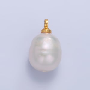 May include: A large, white, baroque pearl pendant with a gold bail.