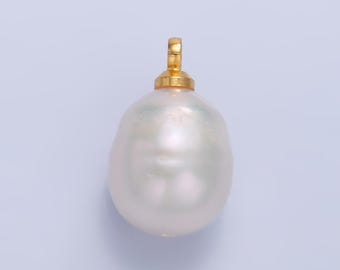 May include: A large, white, baroque pearl pendant with a gold bail.