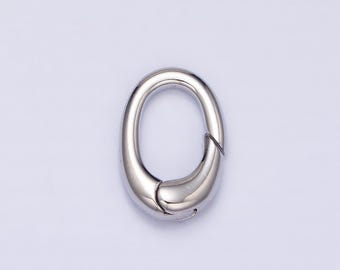 May include: A silver oval-shaped lobster clasp with a spring-loaded closure.