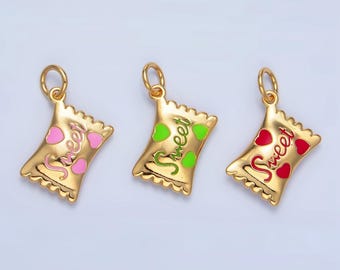 May include: Three gold charm pendants shaped like candy bags with the word "Sweet" written on them. Each bag has a different coloured heart: pink, green, and red.