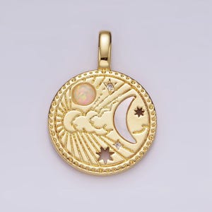 May include: Gold pendant necklace featuring a circular design with a crescent moon, sun, and clouds. The pendant has a white opal stone and clear cubic zirconia stones.