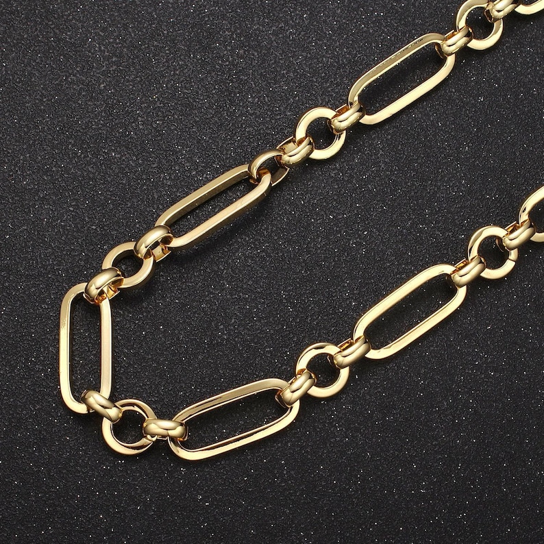 May include: A gold chain necklace with a simple, oval-shaped link design.